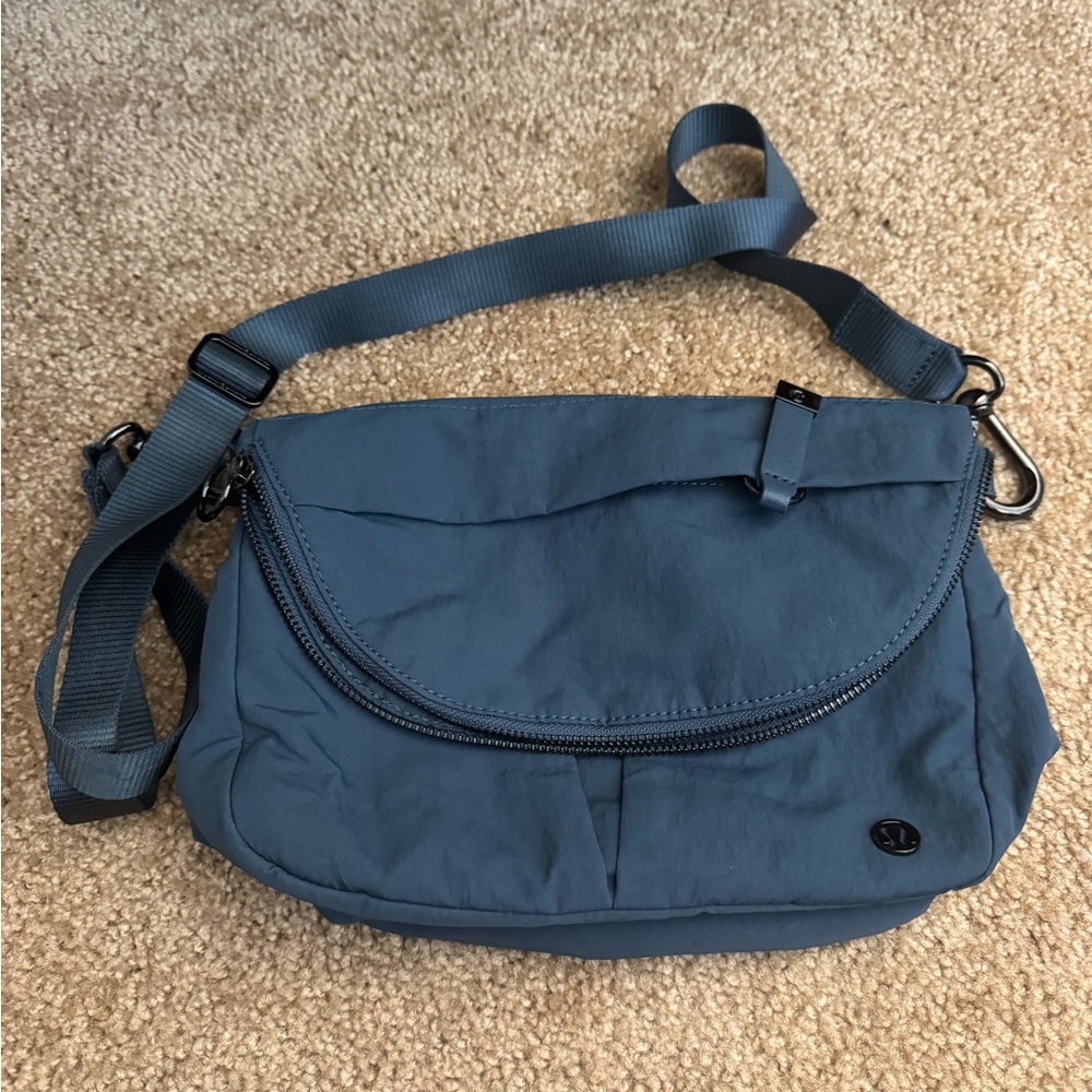 Near perfect. Used once Iron Blue crossbody